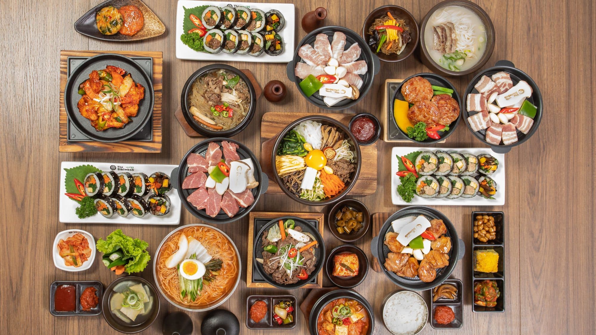 The Bibimbab carte from above: dolsot bibimbap, griddle meats, gimbab, noodles, stews and banchan